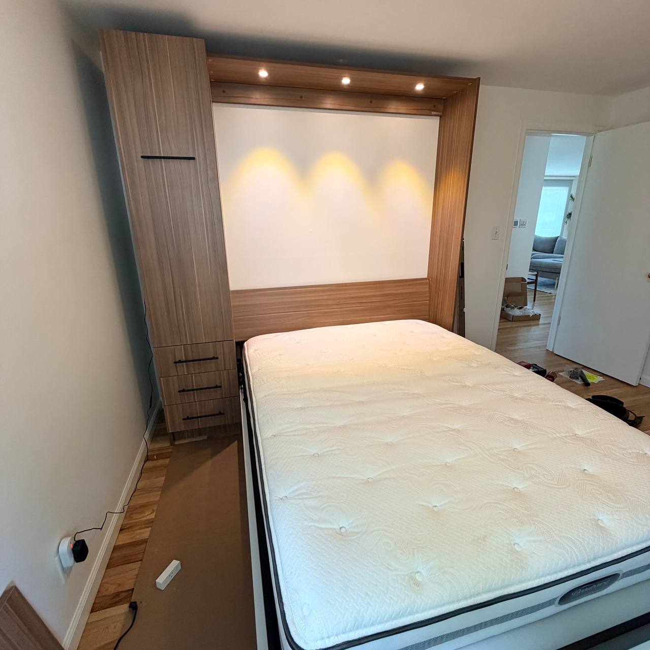BredaBeds queen murphy bed installed with LED lighting and side storage cabinet