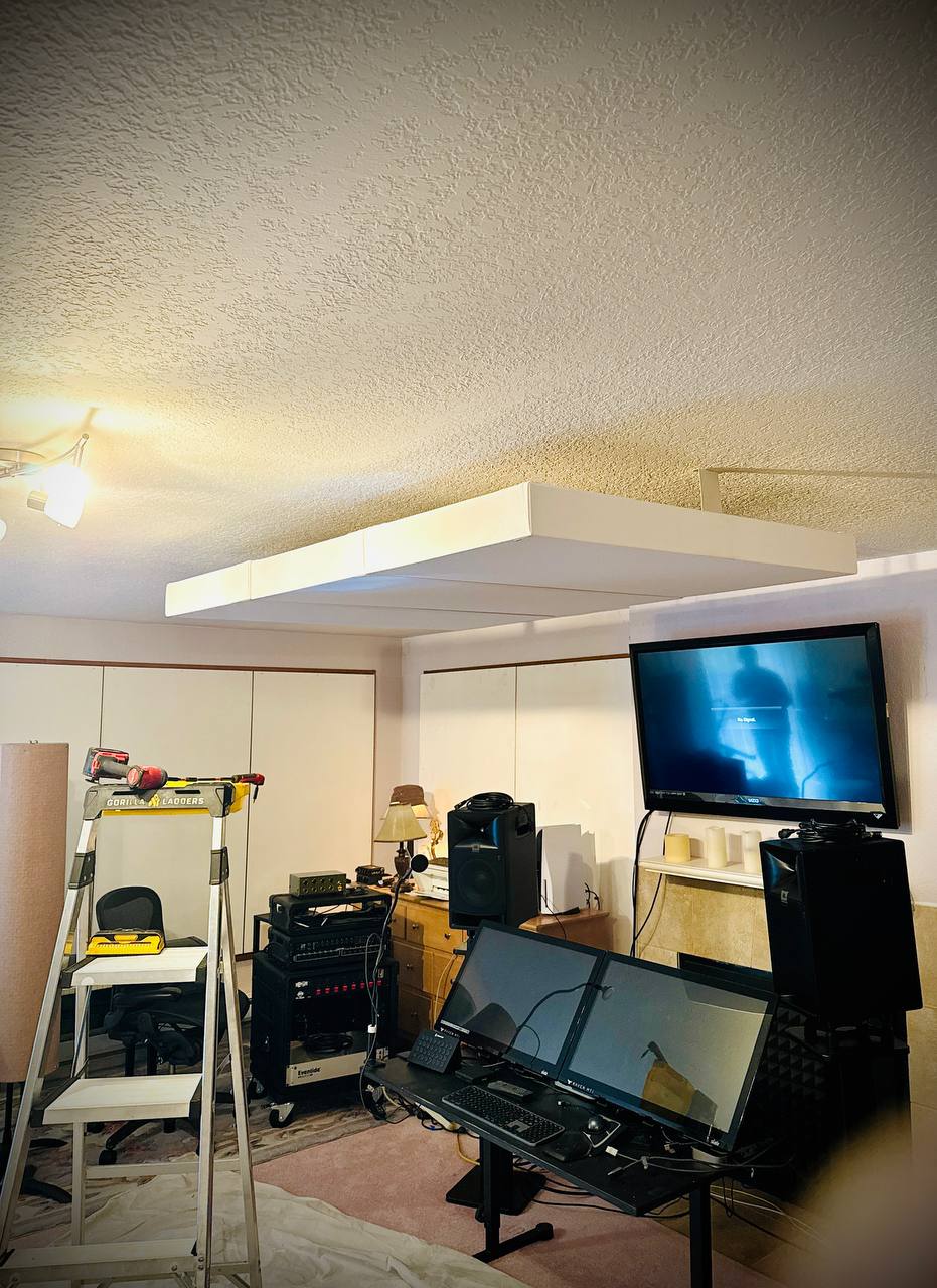 Ladder setup for acoustic ceiling cloud installation in home studio