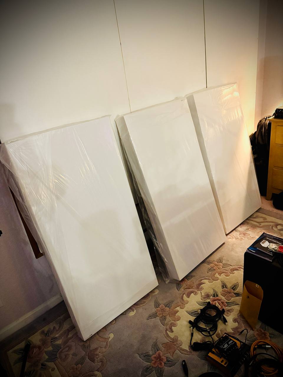 Fabric-wrapped acoustic panels and bass traps ready for installation